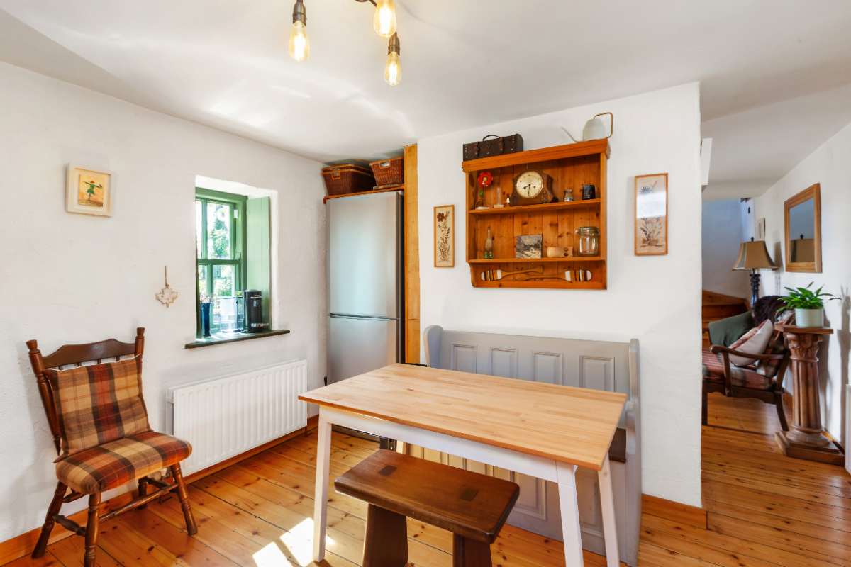 Dining nook with settle bench and dresser
